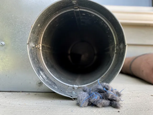 Bexley Dryer Vent Cleaning technician using specialized equipment to clear severe dryer vent blockage in Bexley